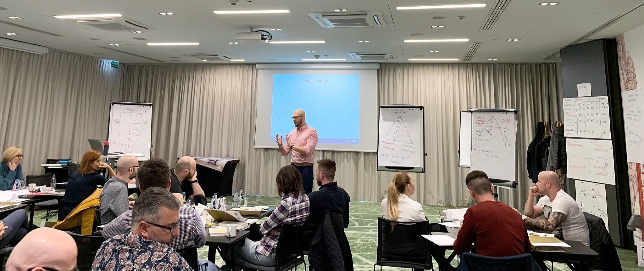 Wojciech facilitating a group session at the flipchart