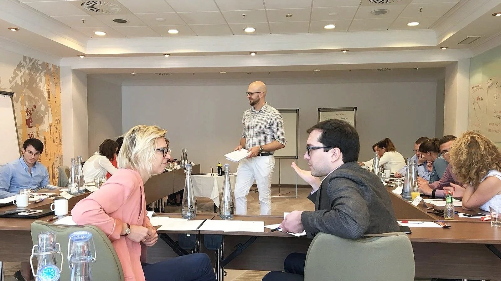 Participants discussing an exercise at a workshop table